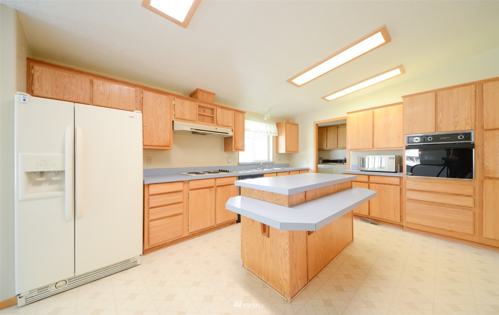 8735 178th Avenue Southwest Rochester, WA 98579 - Photo 8 of 26 a kitchen with stainless steel appliances granite countertop a stove a sink and a refrigerator