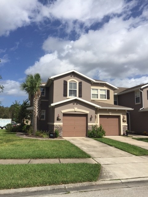 200 Sienna Place St. Augustine, FL 32084 - Photo 1 of 24 a front view of a house with a garden