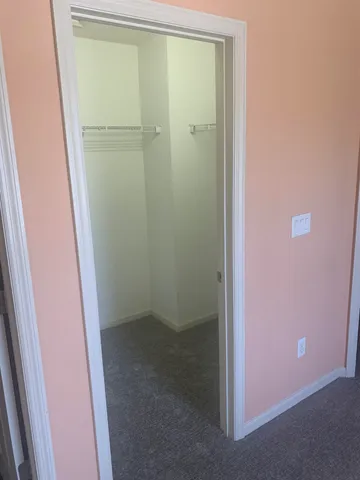 an empty room with a empty space and windows