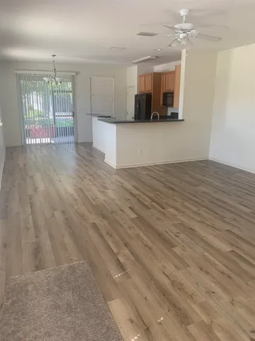 a view of a kitchen with a sink and a microwave