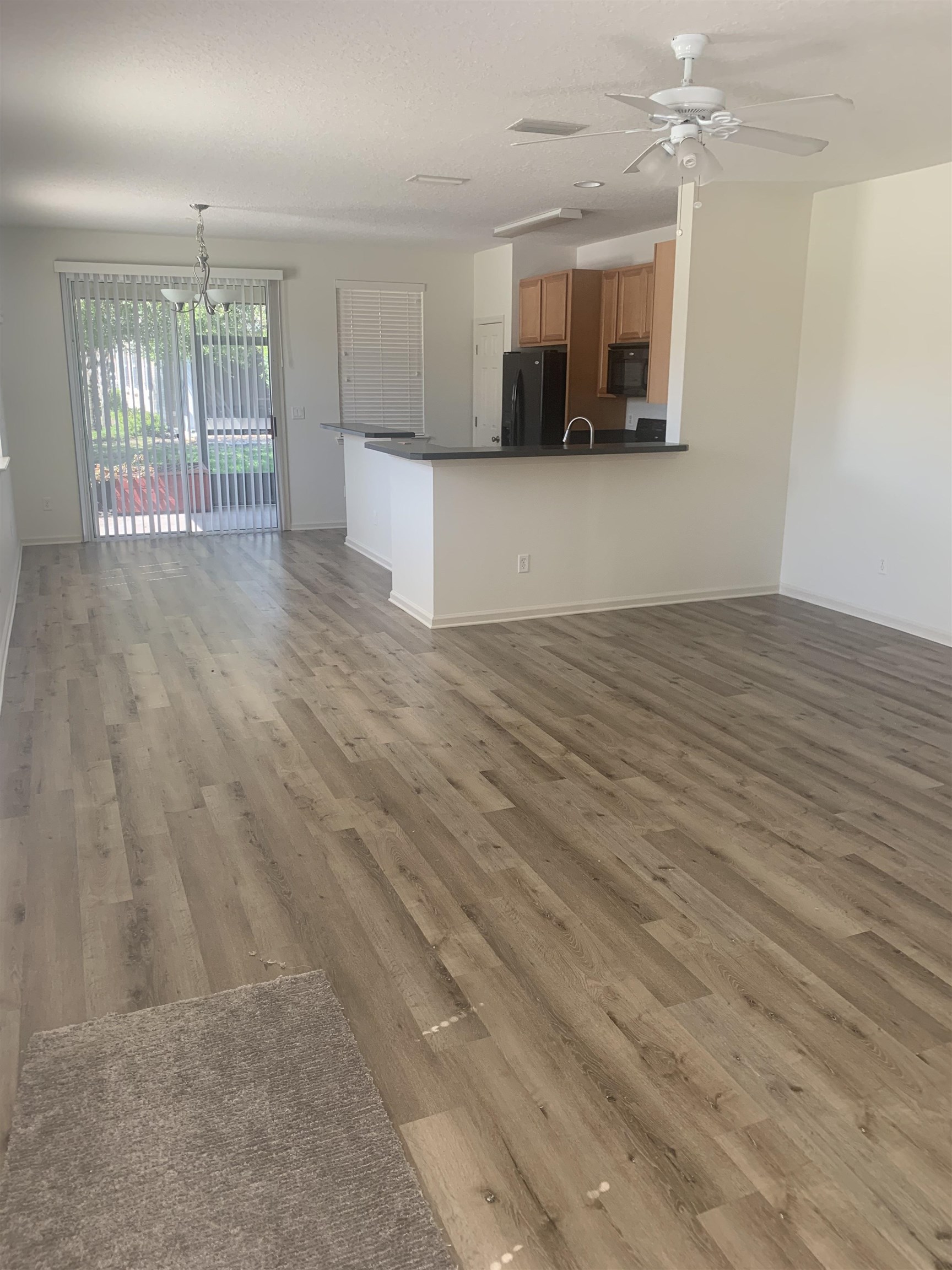 200 Sienna Place St. Augustine, FL 32084 - Photo 8 of 24 a view of a kitchen with a sink and a microwave
