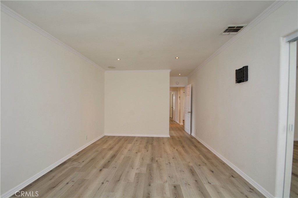 12301 Rives Avenue Downey, CA 90242 - Photo 9 of 20 a view of an empty room with wooden floor