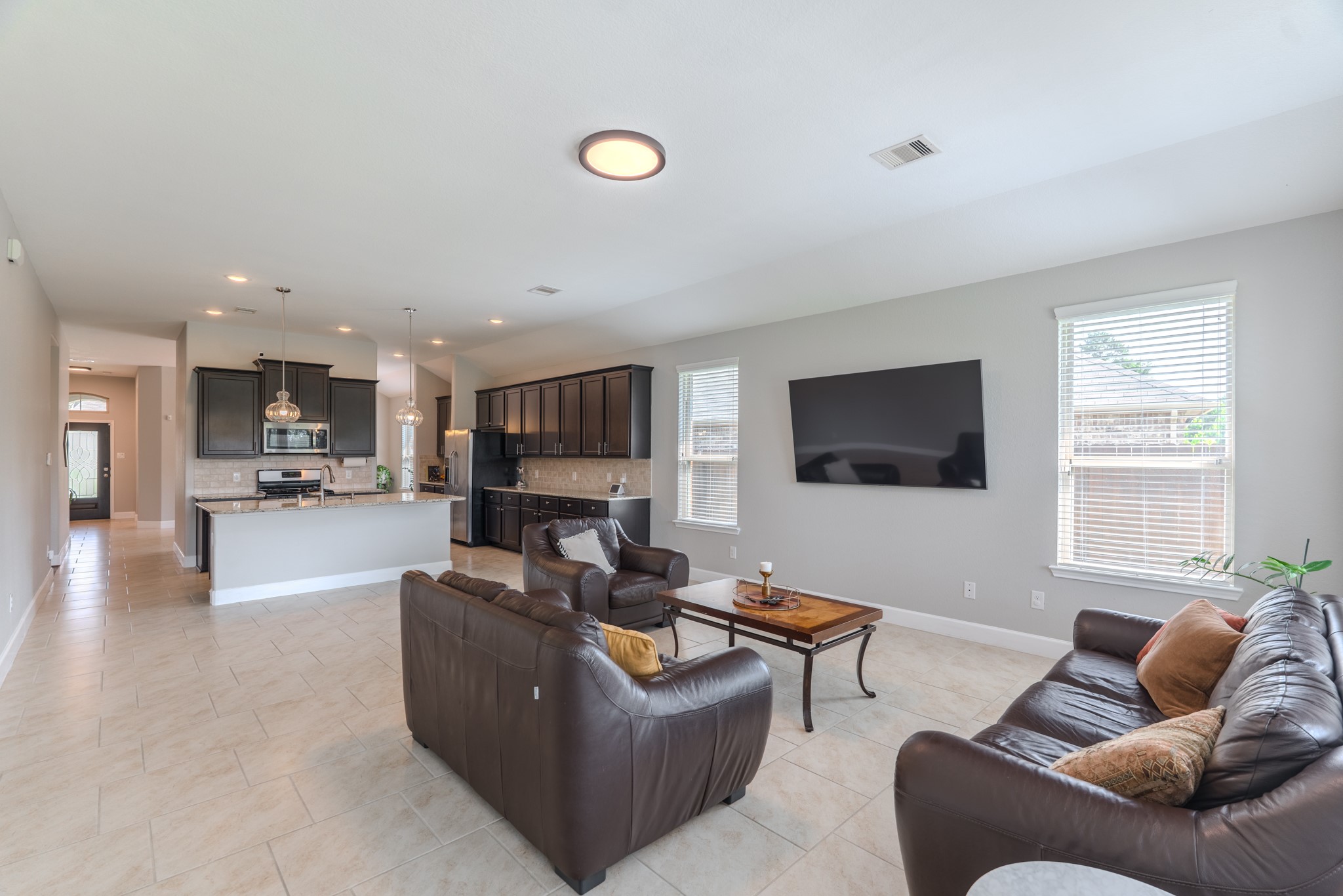 24322 North Newcastle Bay Trail Spring, TX 77389 - Photo 21 of 50 a living room with furniture and a flat screen tv