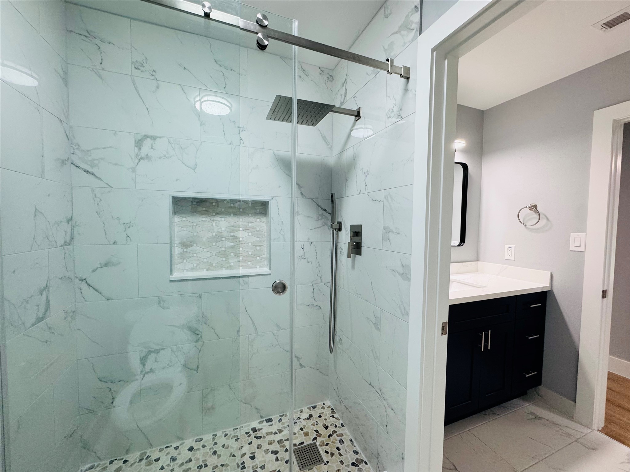 10934 Lilleux Road Houston, TX 77067 - Photo 17 of 27 a bathroom with a shower and a sink