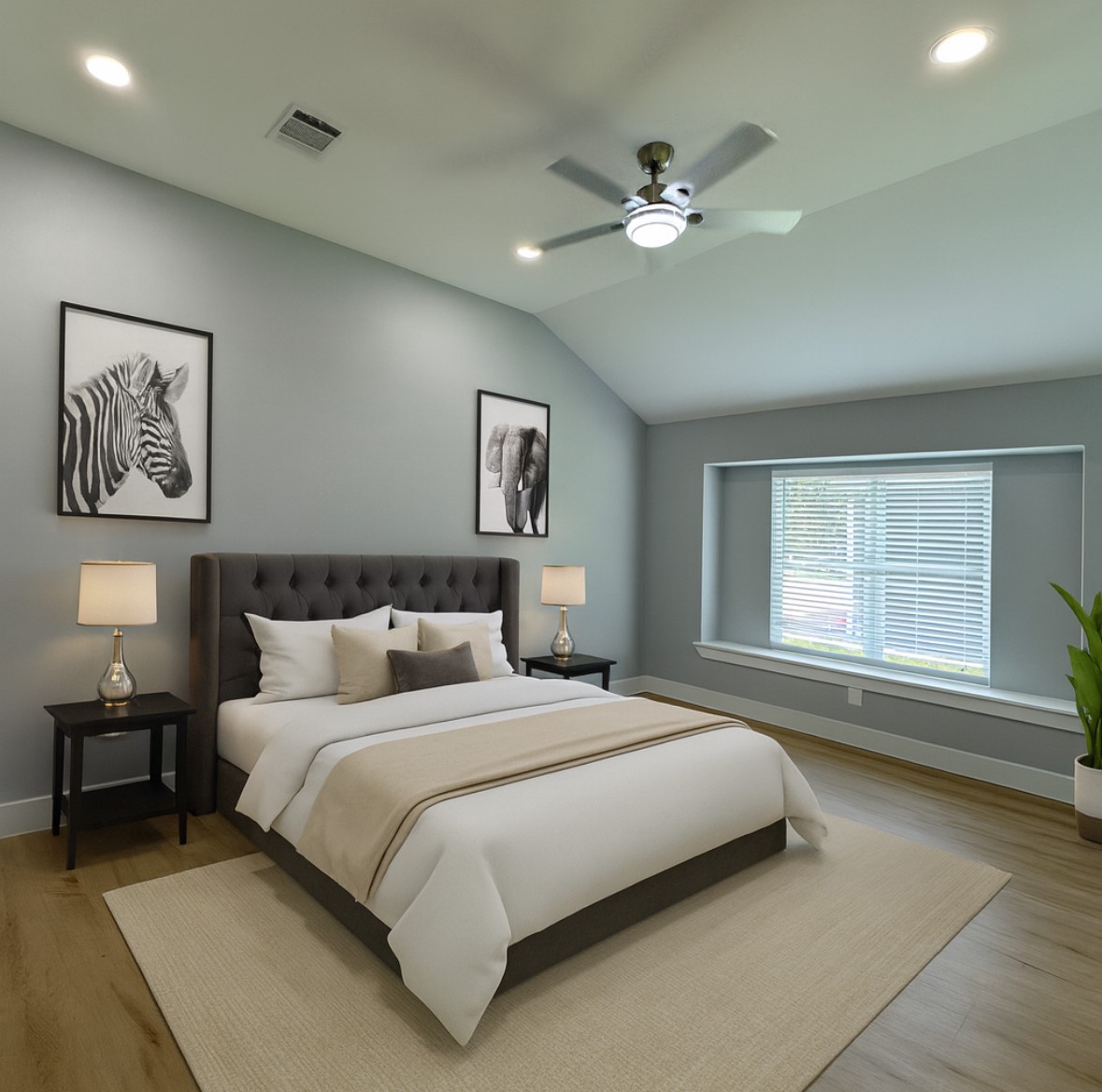 10934 Lilleux Road Houston, TX 77067 - Photo 18 of 27 a bedroom with a large bed and a chandelier