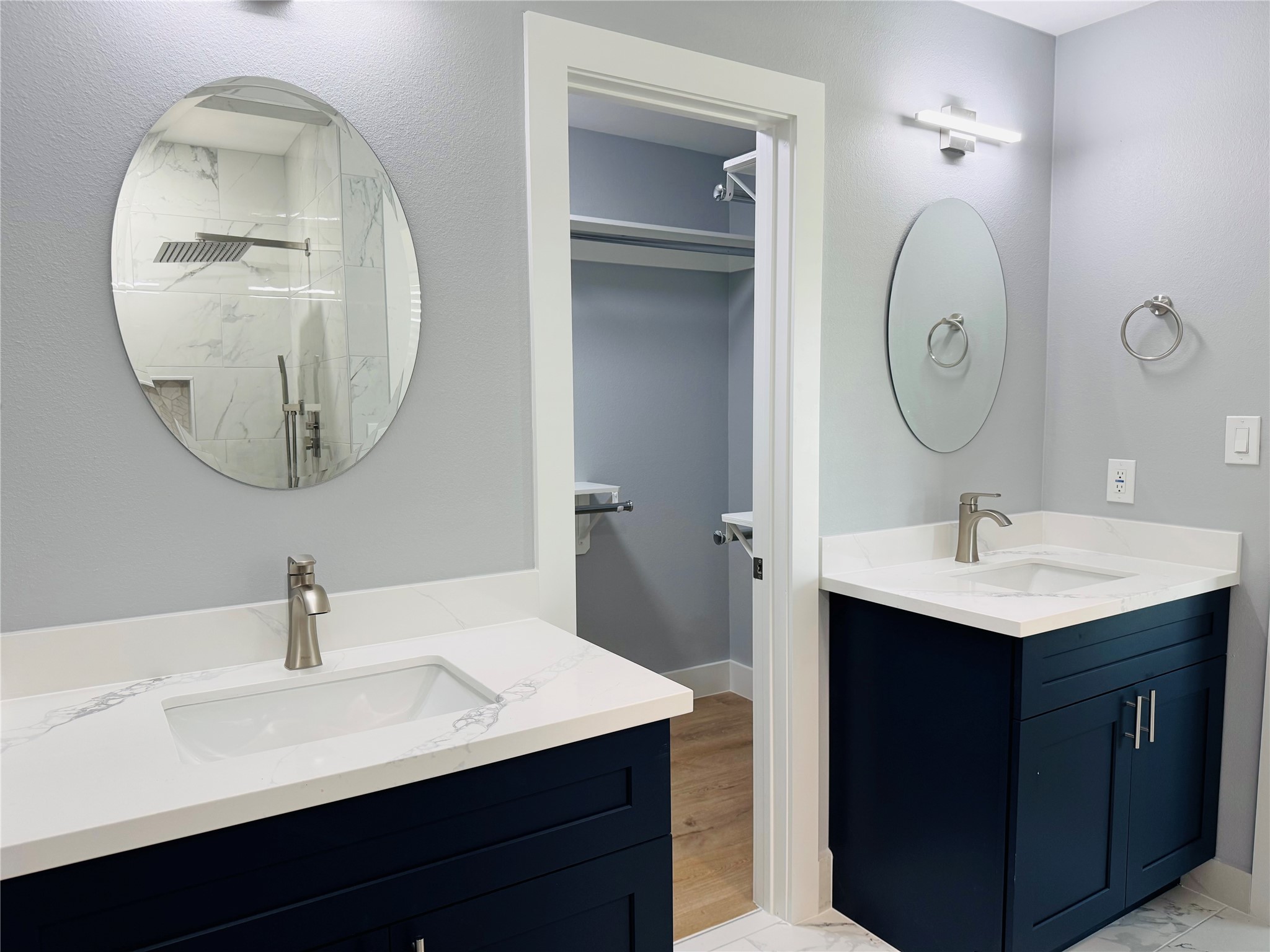 10934 Lilleux Road Houston, TX 77067 - Photo 23 of 27 a bathroom with a sink vanity and a mirror