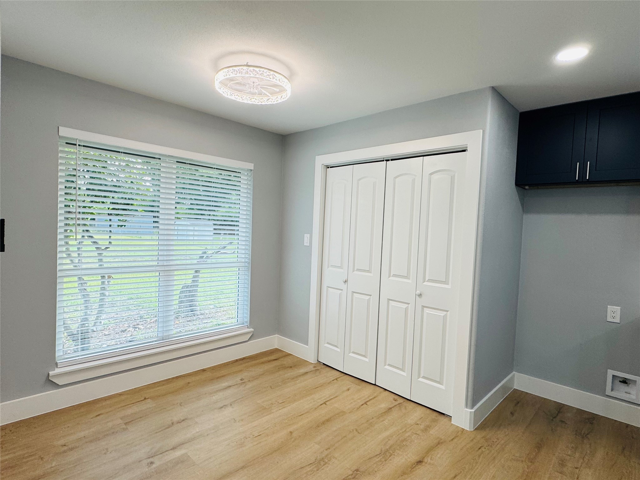 10934 Lilleux Road Houston, TX 77067 - Photo 8 of 27 an empty room with wooden floor and windows