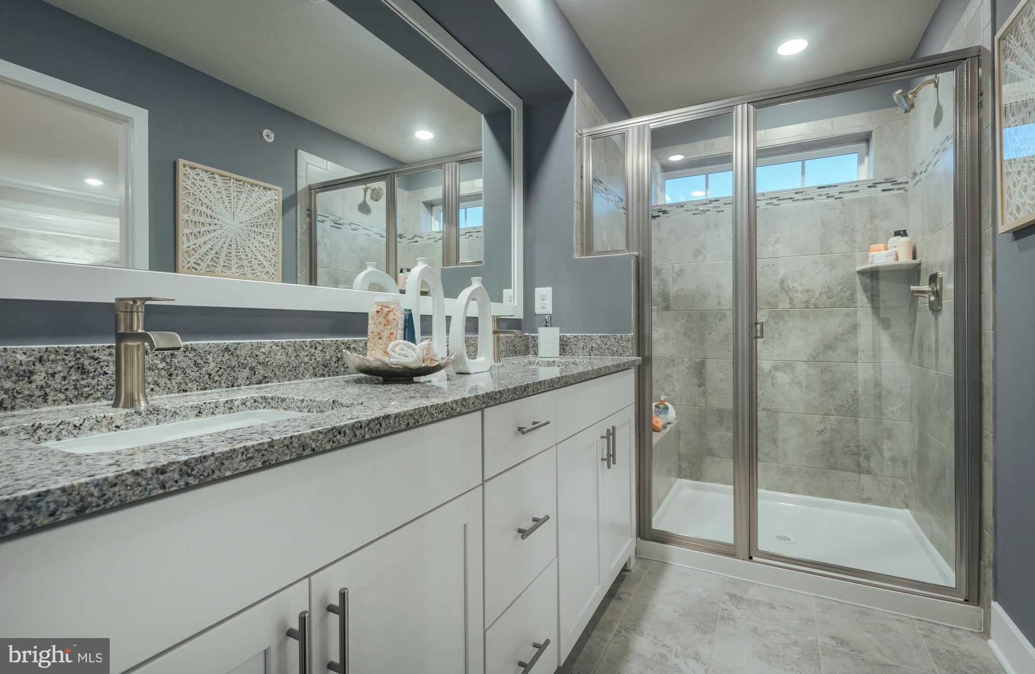 1841 Ritter Road Windsor Mill, MD 21244 - Photo 14 of 17 a bathroom with double sink and shower