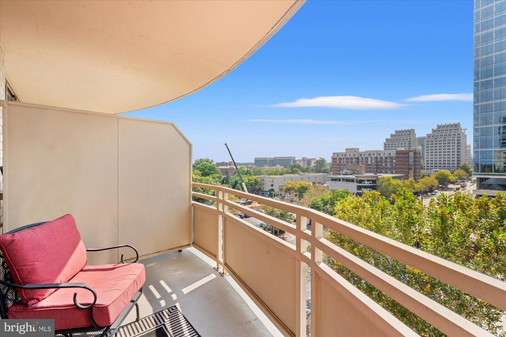 4801 Fairmont Avenue, Unit 705 Bethesda, MD 20814 - Photo 16 of 19 a view of a chairs and table in patio