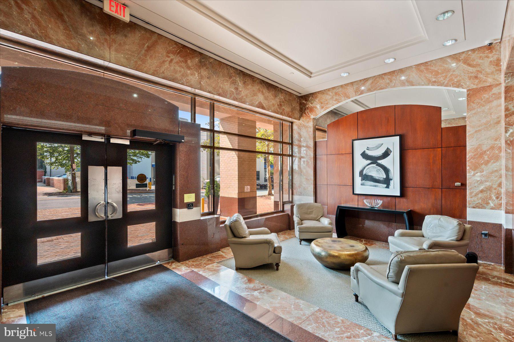 4801 Fairmont Avenue, Unit 705 Bethesda, MD 20814 - Photo 17 of 19 a living room with furniture and a window