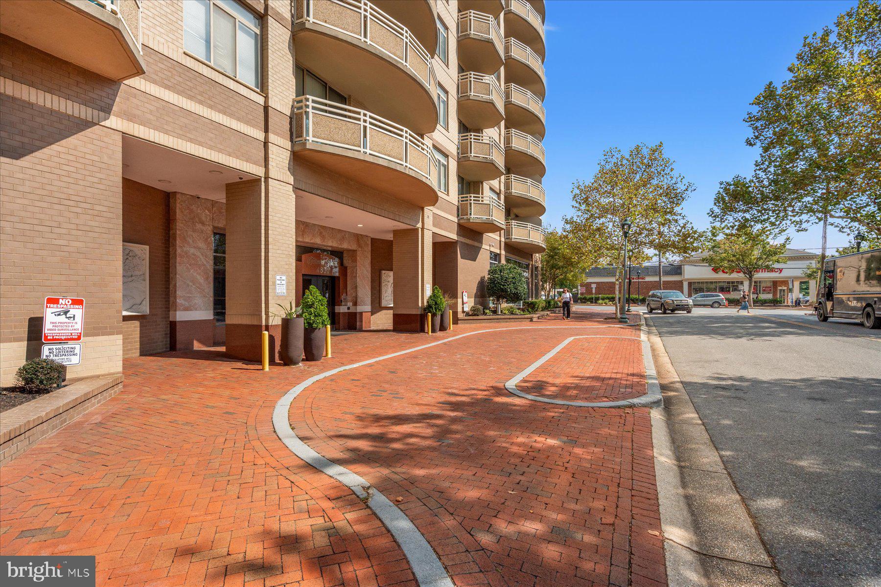 4801 Fairmont Avenue, Unit 705 Bethesda, MD 20814 - Photo 18 of 19 a swimming pool with outdoor seating and yard