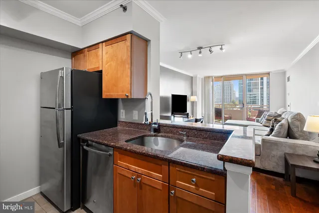 a kitchen with a refrigerator and a sink