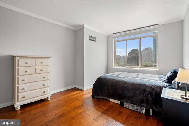 a bed room with a bed and a window