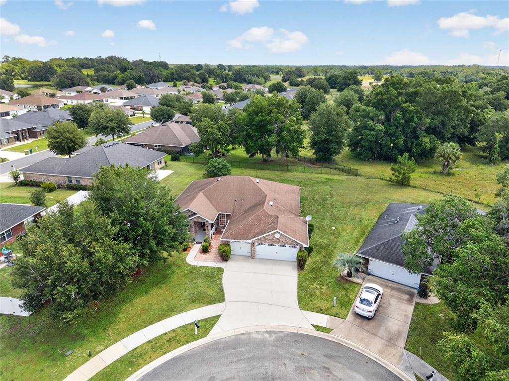 4319 Southwest 63rd Street Ocala, FL 34474 - Photo 27 of 29 an aerial view of a house with garden space and street view