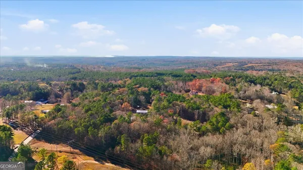an aerial view of residential house and green space