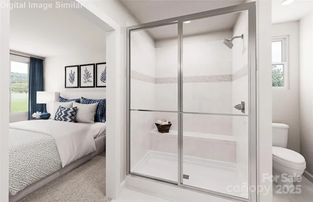 a bathroom with a glass shower door