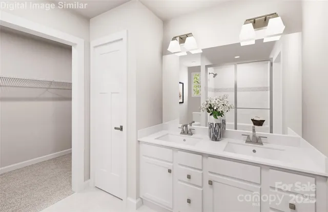 a bathroom with a double vanity sink mirror and