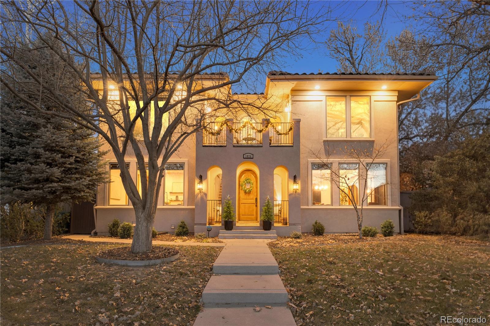 1026 South Cook Street Denver, CO 80209 - Photo 1 of 44 a front view of a house with a yard