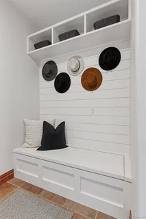 a view of a livingroom with furniture and a window