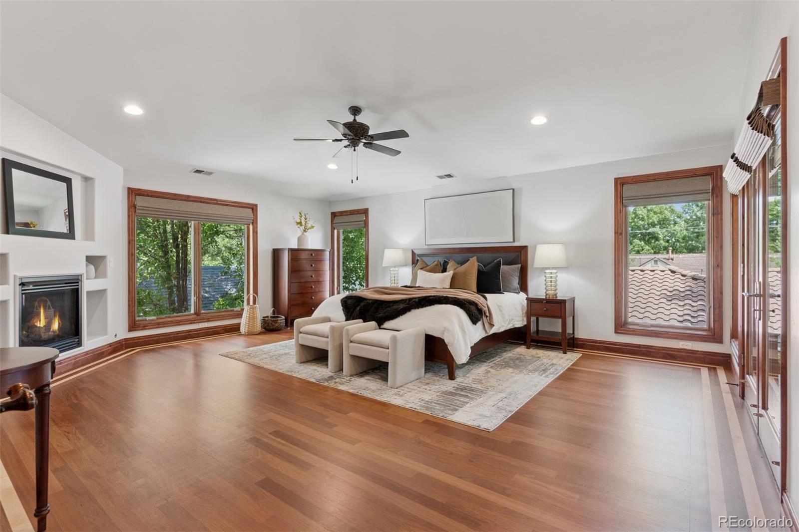 1026 South Cook Street Denver, CO 80209 - Photo 22 of 44 a bedroom with a large bed and a large window