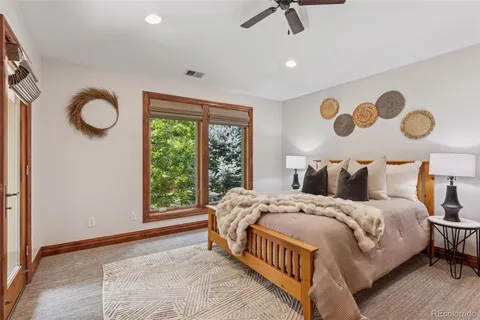 a bathroom with a granite countertop toilet a sink and bathtub