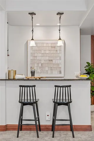 a view of an empty room with closet and bathroom