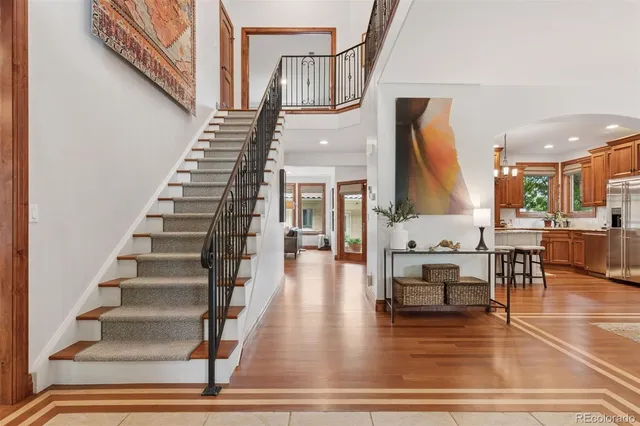 a view of entryway and hall with wooden floor