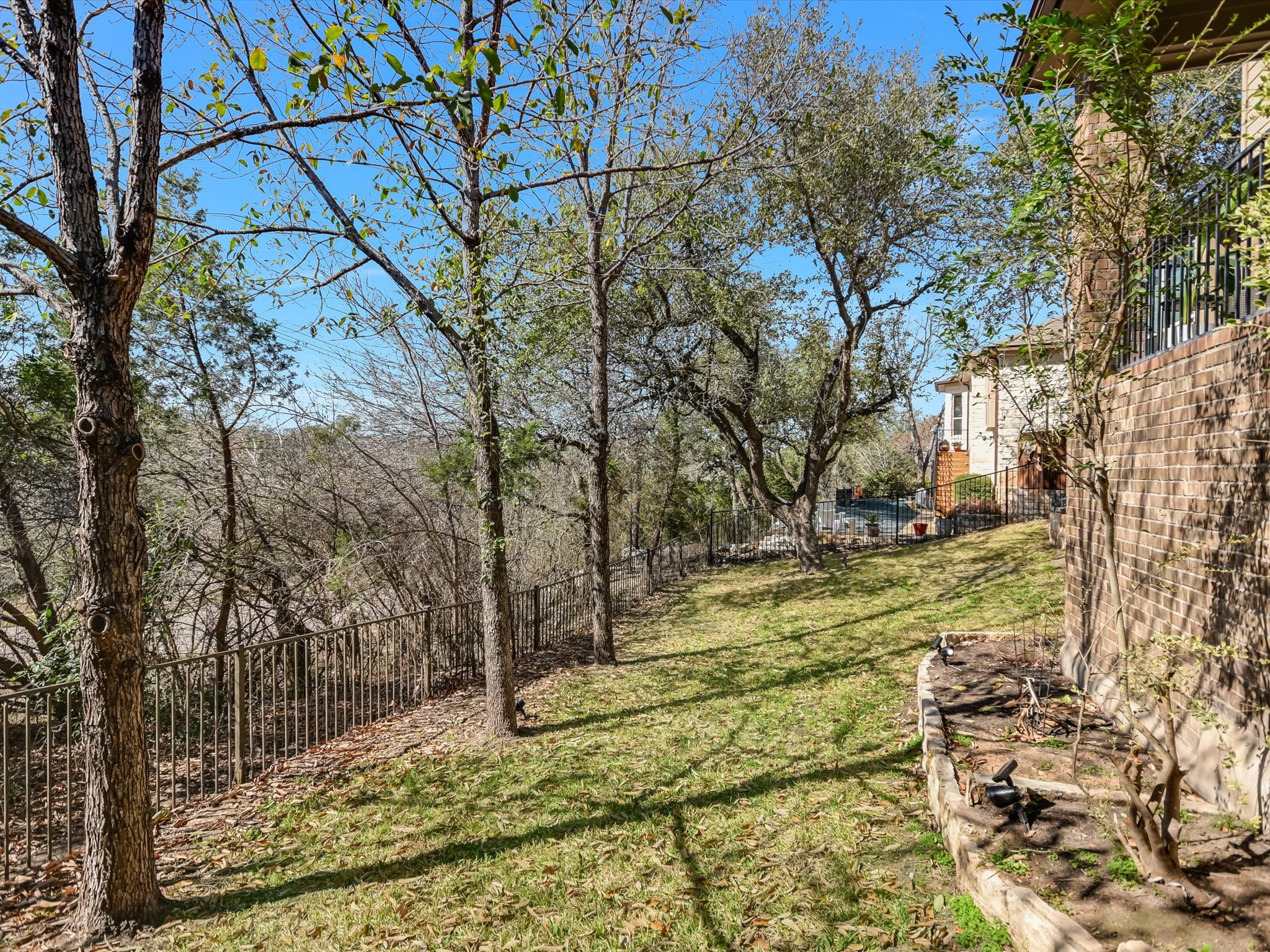 201 Bellagio Drive Austin, TX 78734 - Photo 29 of 31 North Lakeway Village residents enjoy a well-maintained neighborhood with sidewalks and a clubhouse with a sparking pool for summer dips.