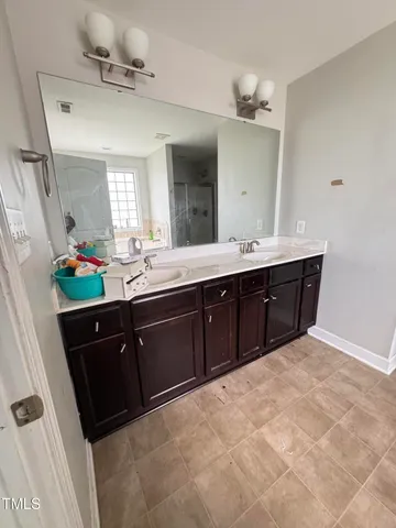 a bathroom with a bathtub and window