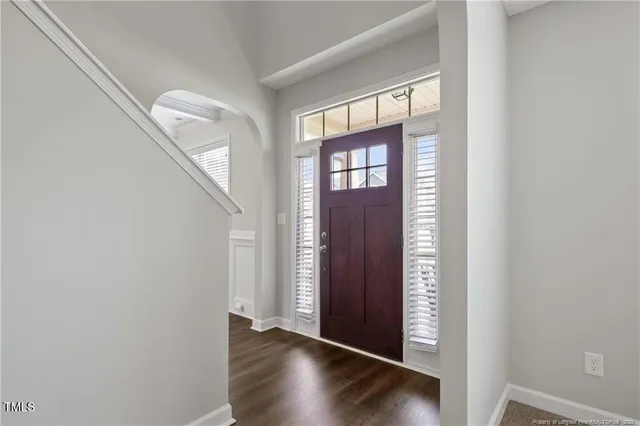 a view of an entryway with wooden floor