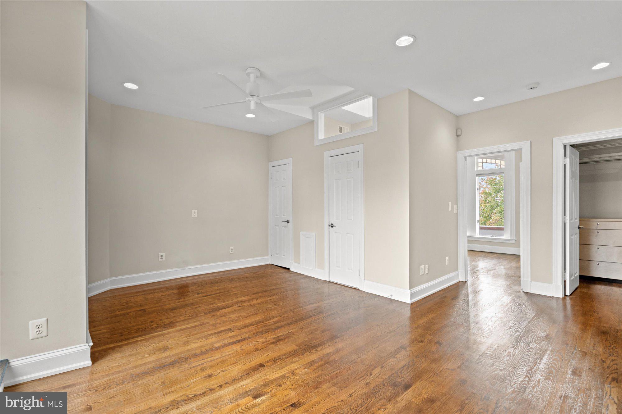 1209 S Street Northwest Washington, DC 20009 - Photo 30 of 64 a view of an empty room with wooden floor