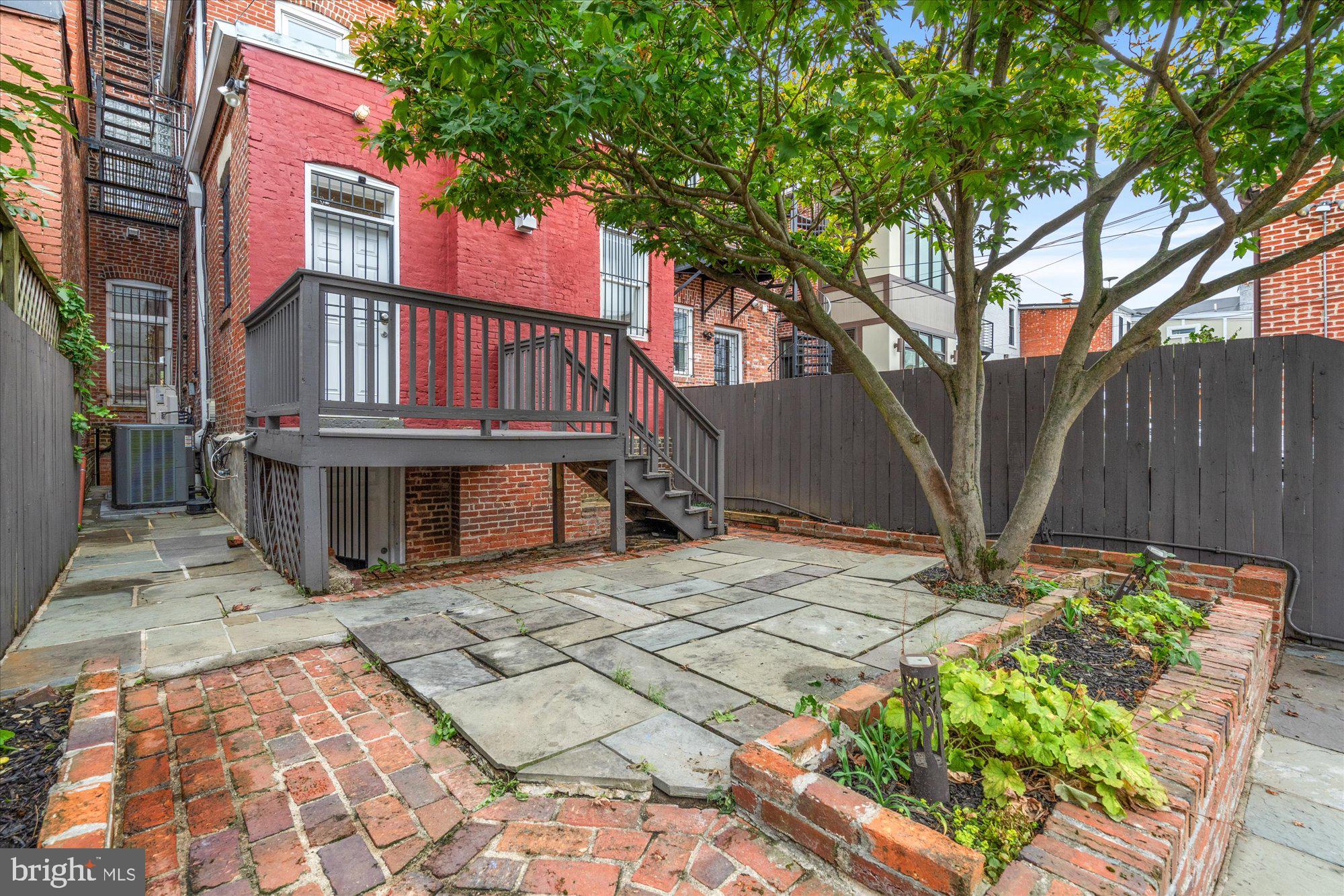 1209 S Street Northwest Washington, DC 20009 - Photo 40 of 64 a view of a house with wooden fence