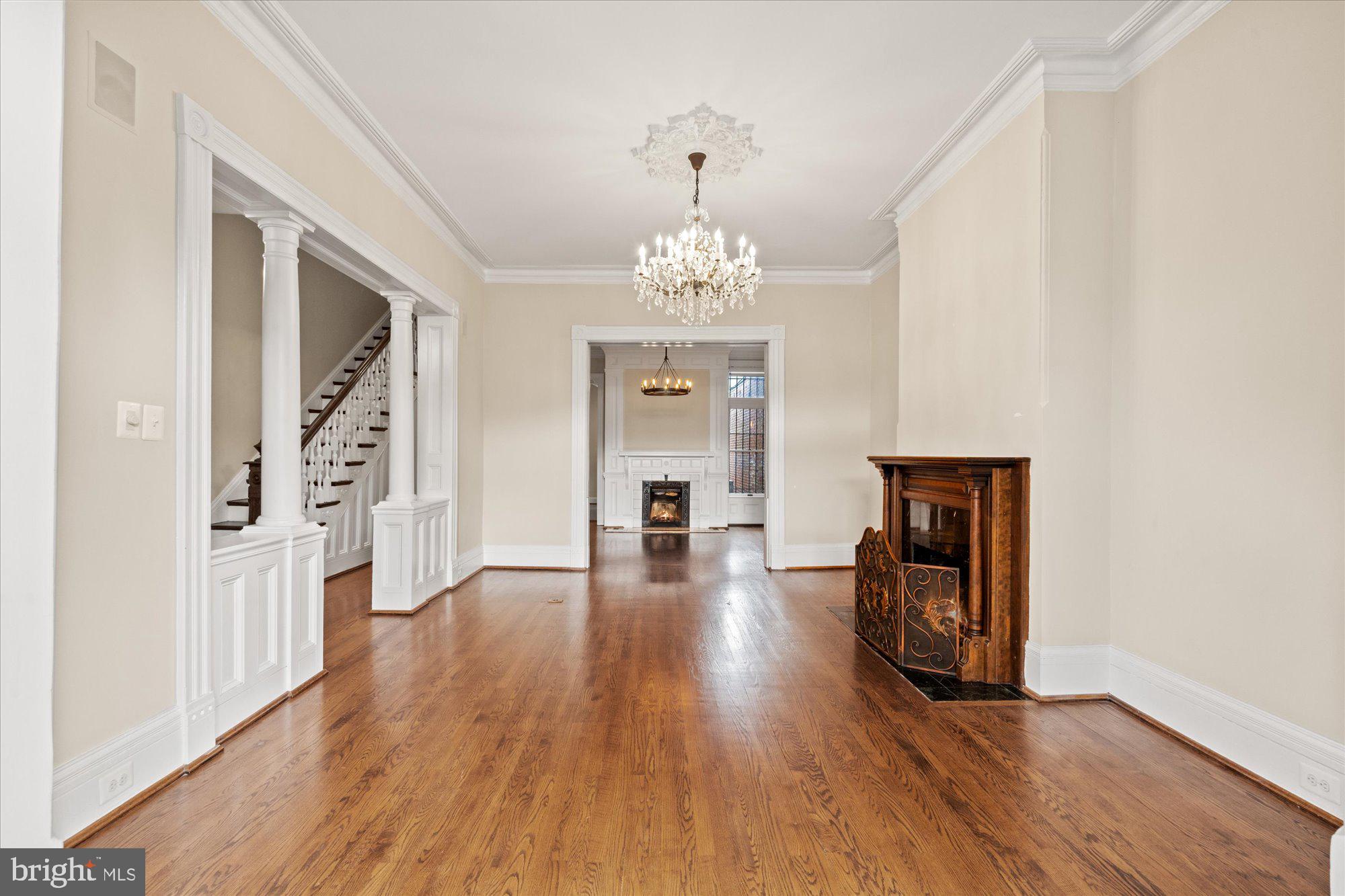 1209 S Street Northwest Washington, DC 20009 - Photo 4 of 64 wooden floor in an empty room with a window