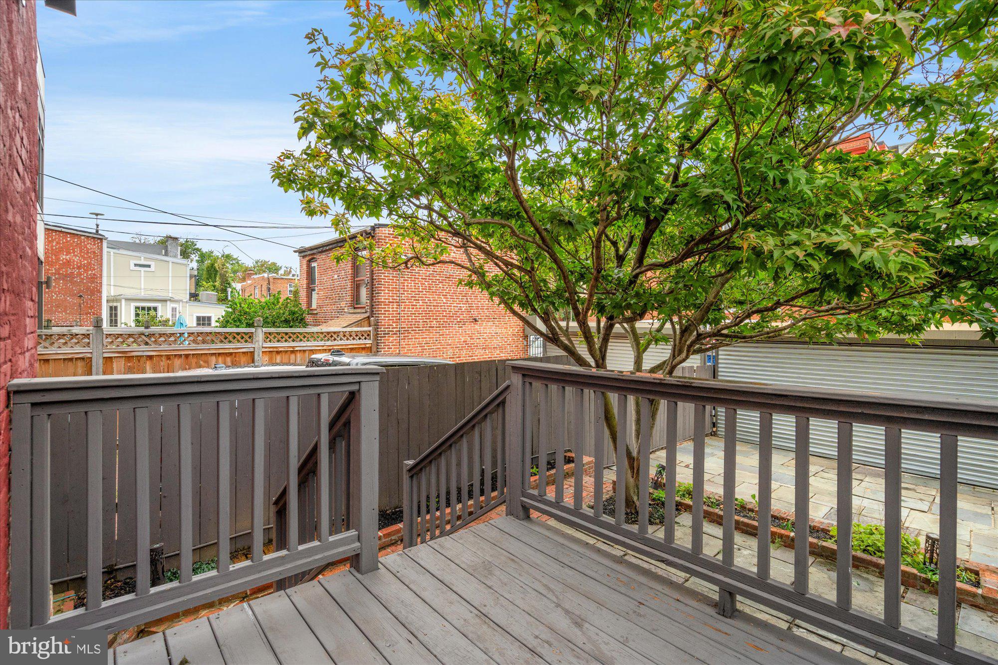 1209 S Street Northwest Washington, DC 20009 - Photo 44 of 64 a view of balcony with wooden floor and fence