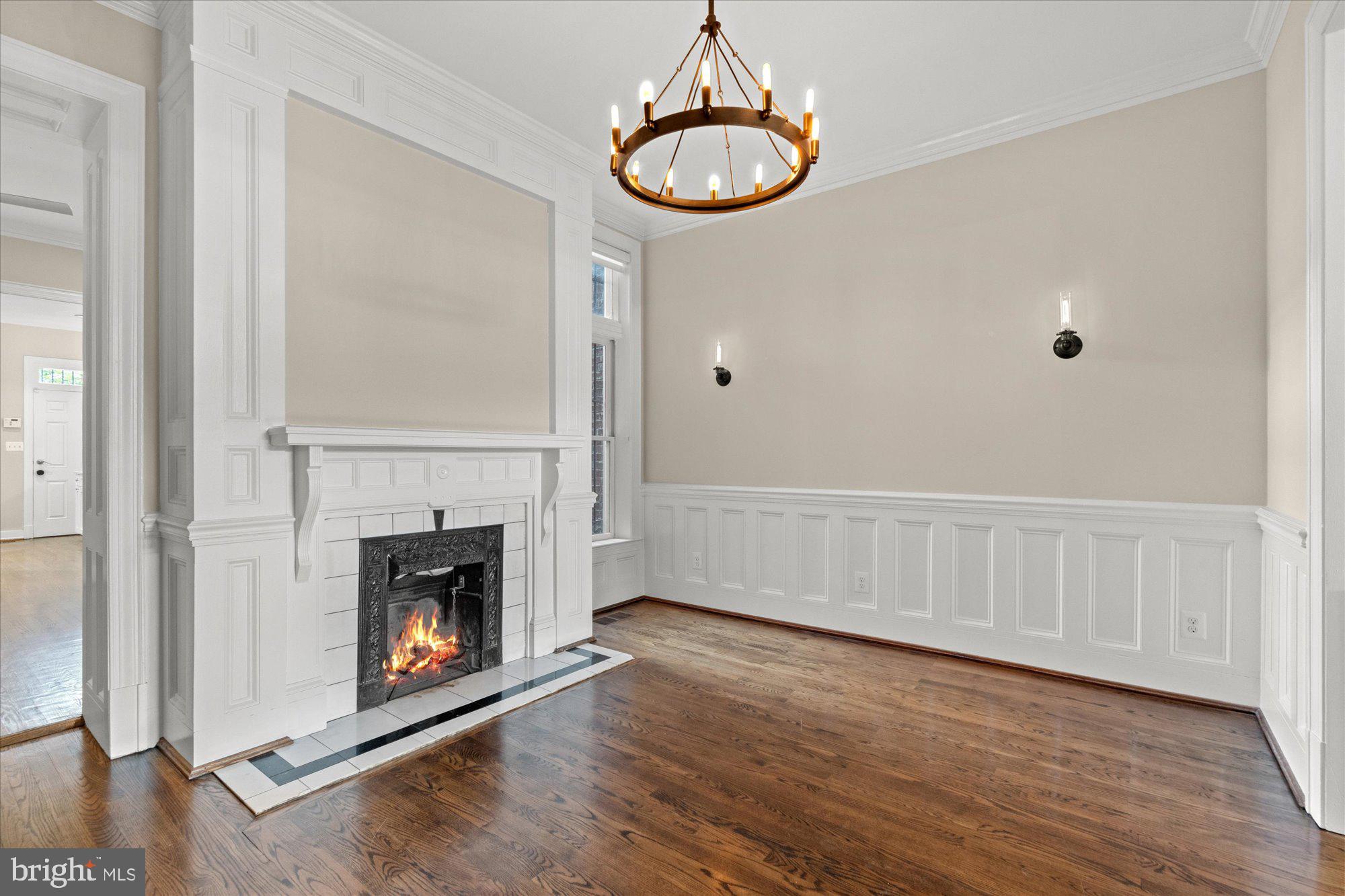 1209 S Street Northwest Washington, DC 20009 - Photo 9 of 64 a view of an empty room with wooden floor and a window