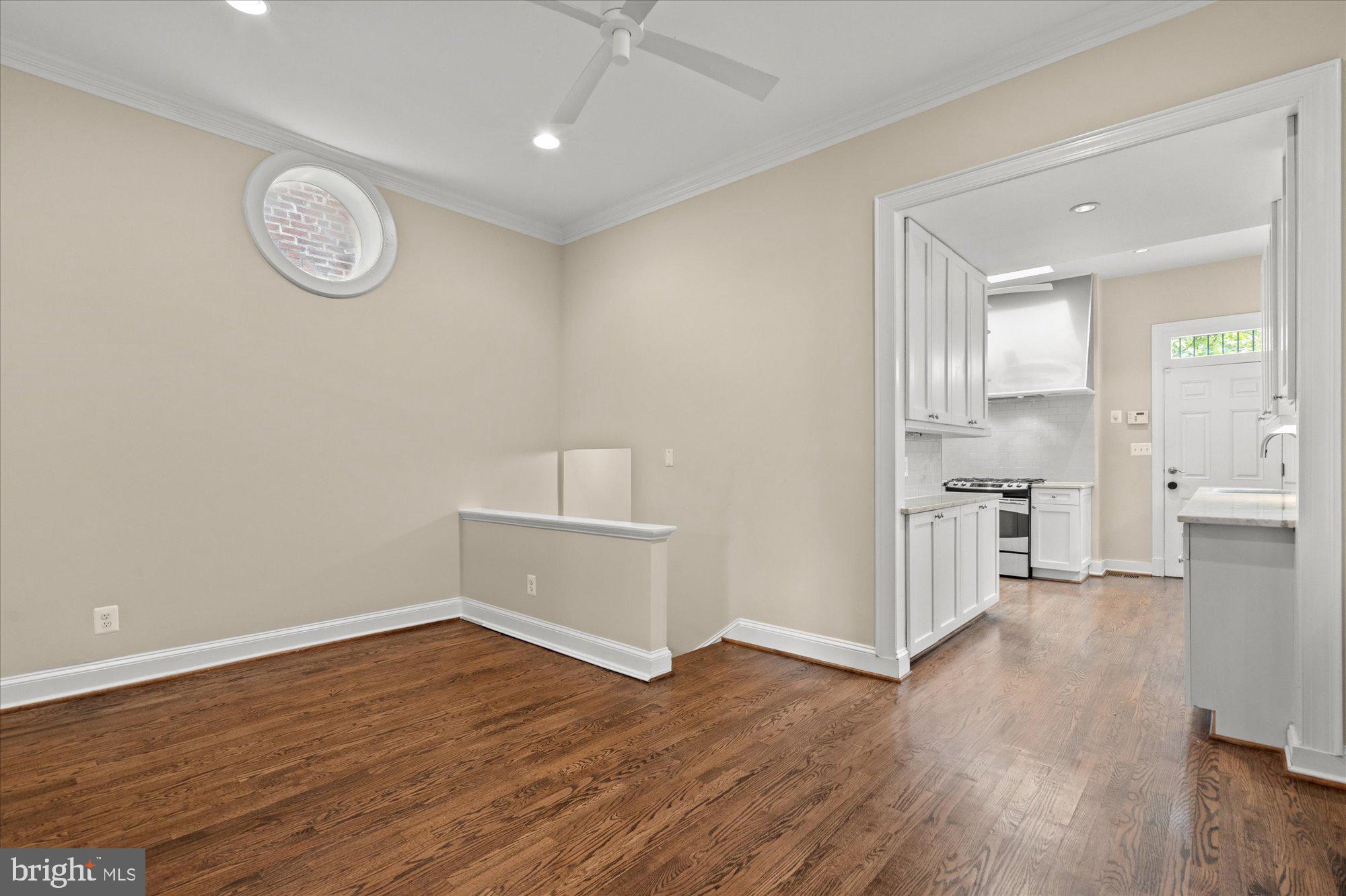 1209 S Street Northwest Washington, DC 20009 - Photo 10 of 64 a view of room with wooden floor and window