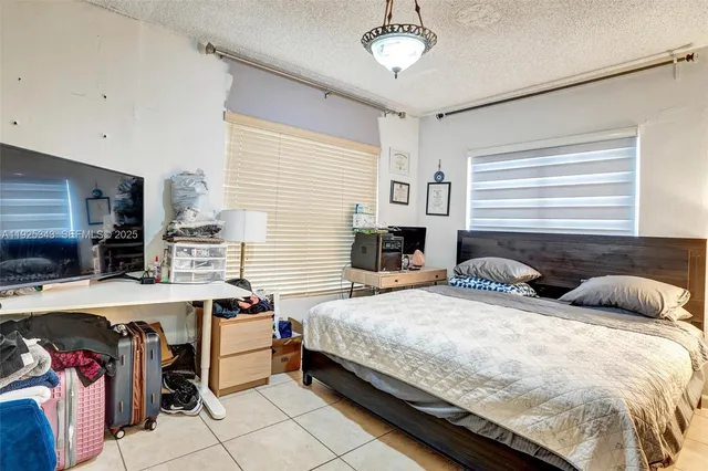 a kitchen with stainless steel appliances a sink dishwasher a microwave and cabinets