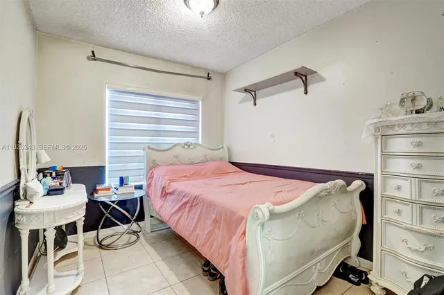 a view of a storage & utility room with dryer and washer