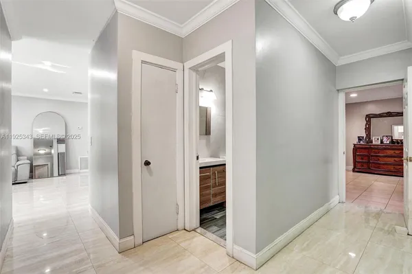 a view of a hallway view with three rooms