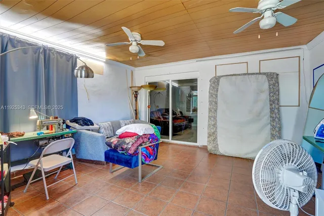 a backyard of a house with barbeque oven table and chairs