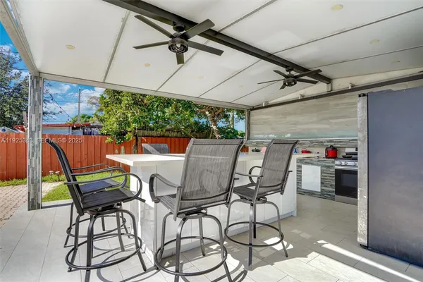 a patio with a table and chairs