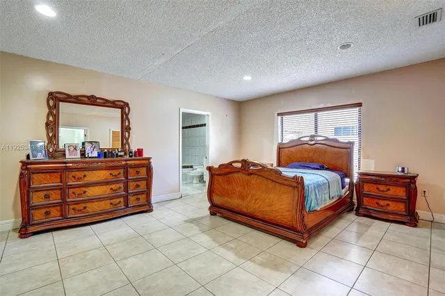 a bedroom with furniture and natural light