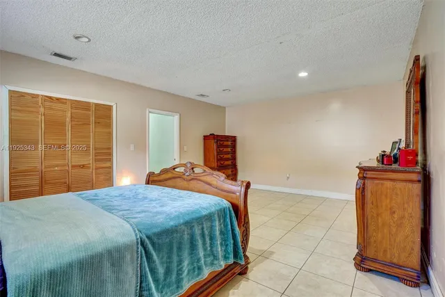 a bathroom with a shower and a glass door