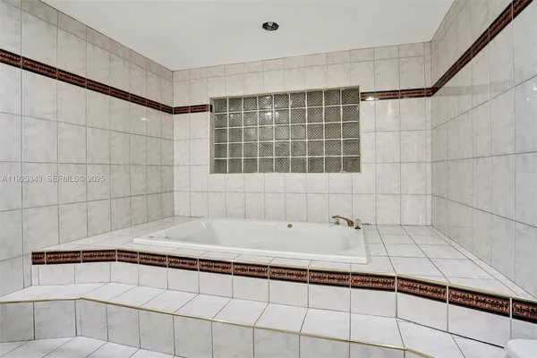 a bathroom with a bathtub and shower