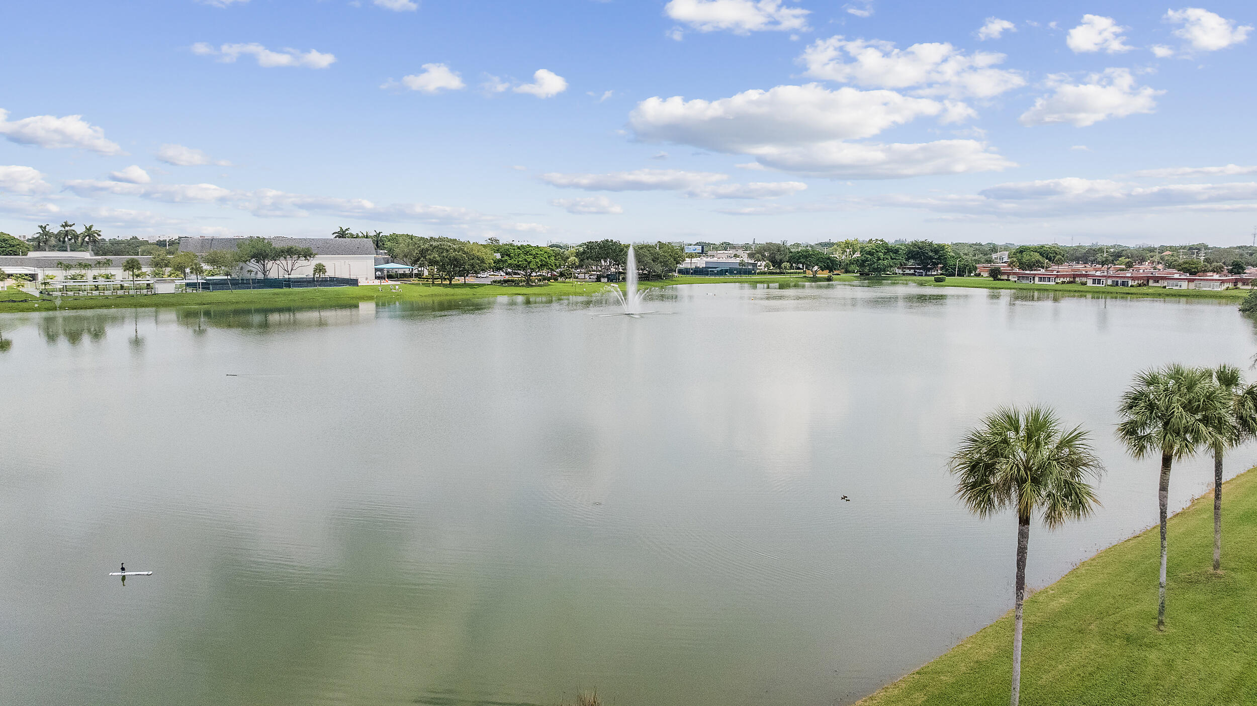 a view of lake with green space