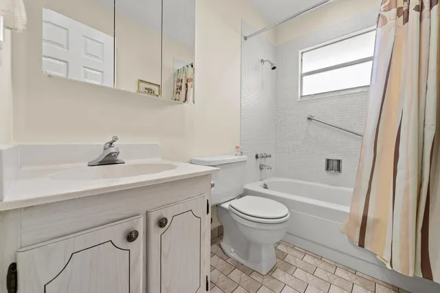 a bathroom with a sink a toilet and a bathtub