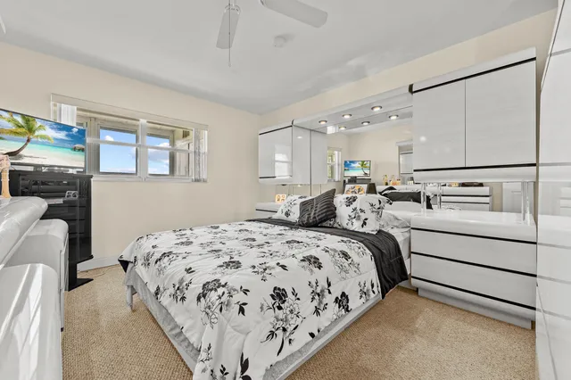 a bedroom with bed and window