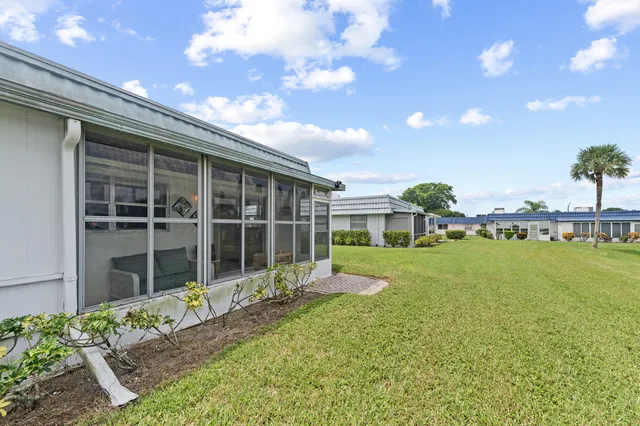 a house view with a sitting space and garden space