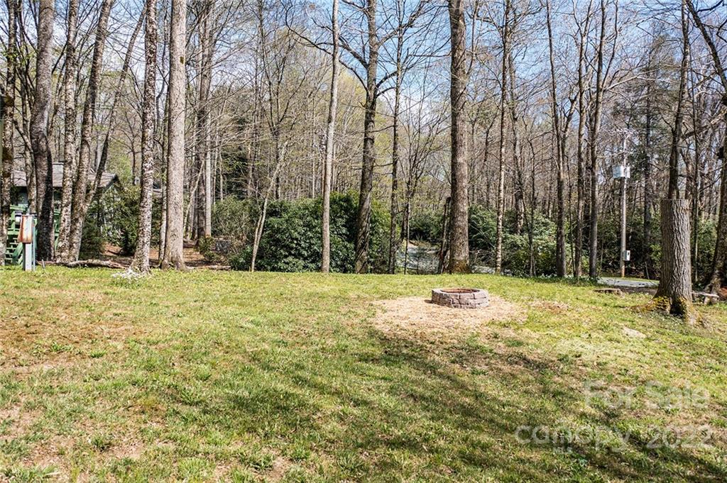 20 Lady Slipper Loop Newland, NC 28657 - Photo 11 of 44 a swimming pool with trees in the background