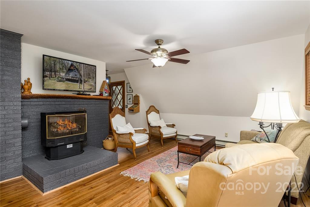 20 Lady Slipper Loop Newland, NC 28657 - Photo 16 of 44 a living room with furniture and a fireplace